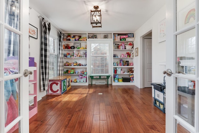 game room with hardwood / wood-style floors