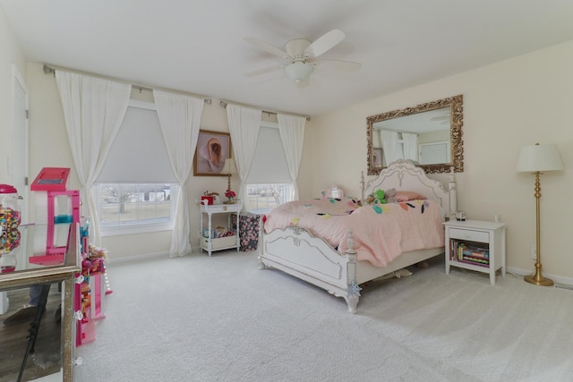 bedroom with a ceiling fan, baseboards, and carpet flooring