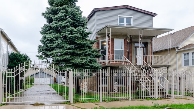 view of front of home with a fenced front yard and an outdoor structure