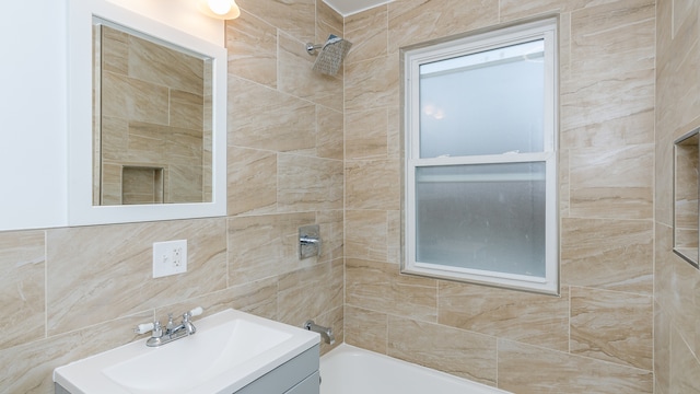 full bath featuring washtub / shower combination and vanity