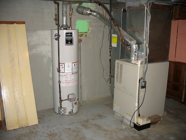 utility room featuring gas water heater and heating unit