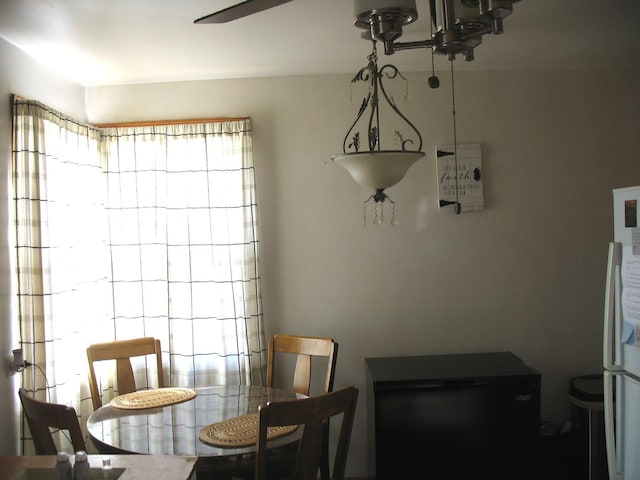 dining area with an inviting chandelier