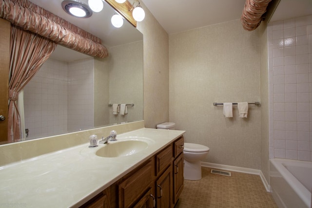 bathroom with tile patterned flooring, visible vents, baseboards, toilet, and vanity