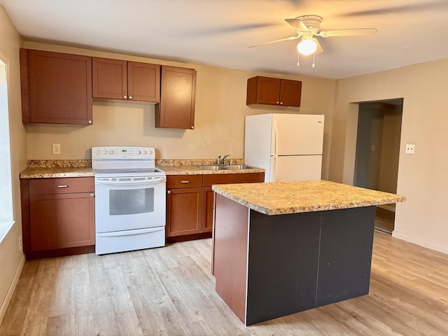 kitchen featuring light countertops, light wood-style floors, brown cabinetry, a sink, and white appliances