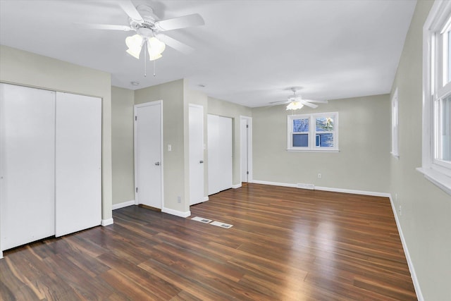 1001 E Sunnycrest Dr, Urbana, IL 61801 - unfurnished bedroom with baseboards, wood finished floors, and ceiling fan