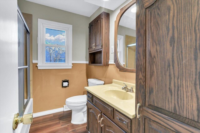 1001 E Sunnycrest Dr, Urbana, IL 61801 - bathroom with baseboards, a shower with shower door, vanity, and wood finished floors