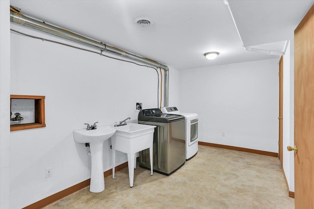 1001 E Sunnycrest Dr, Urbana, IL 61801 - washroom with washer and clothes dryer, baseboards, light flooring, and a sink