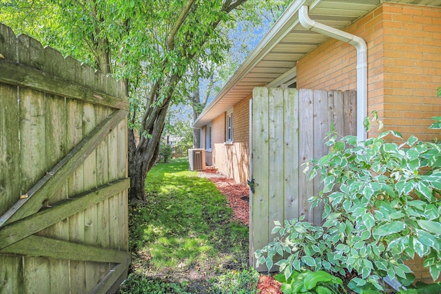 1001 E Sunnycrest Dr, Urbana, IL 61801 - view of home's exterior featuring brick siding and central AC