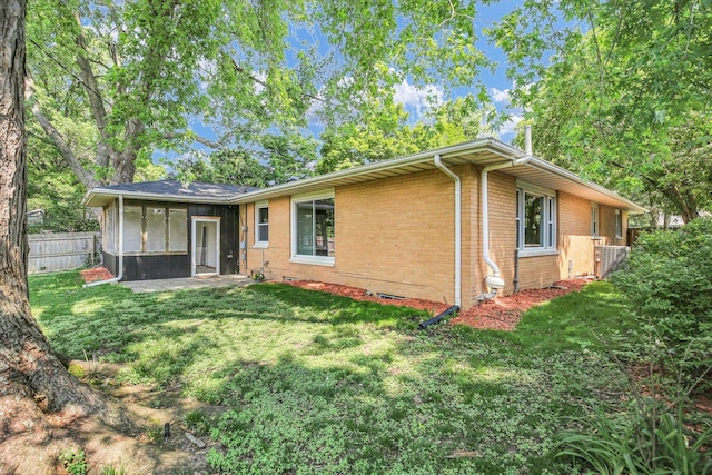 1001 E Sunnycrest Dr, Urbana, IL 61801 - back of house with a sunroom, brick siding, and central AC unit