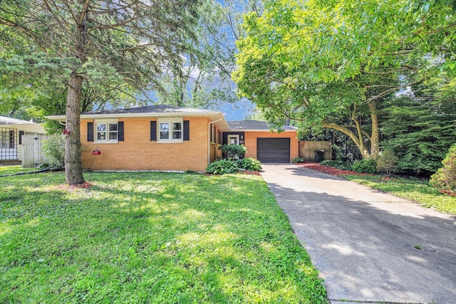 1001 E Sunnycrest Dr, Urbana, IL 61801 - ranch-style house featuring a garage, driveway, and brick siding