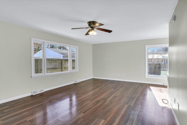 1001 E Sunnycrest Dr, Urbana, IL 61801 - unfurnished room with a ceiling fan, dark wood-style floors, and baseboards