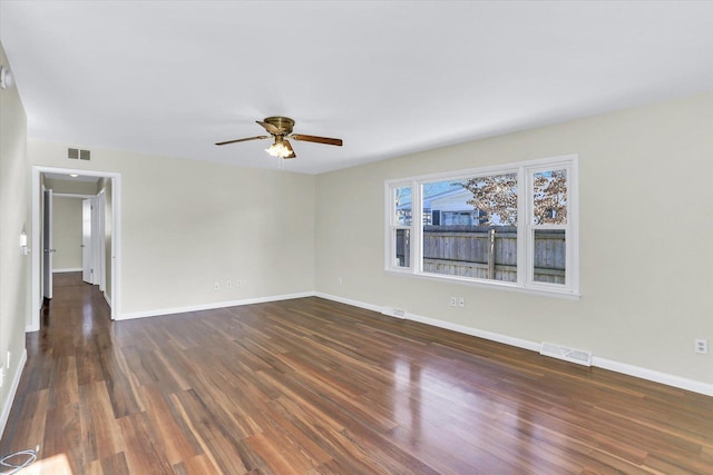 1001 E Sunnycrest Dr, Urbana, IL 61801 - unfurnished room featuring a ceiling fan, dark wood-style flooring, and baseboards