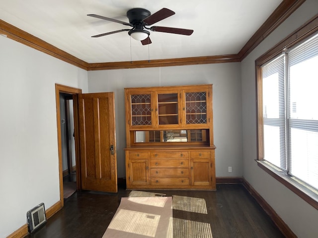 unfurnished dining area with a wealth of natural light, dark wood-style flooring, and visible vents