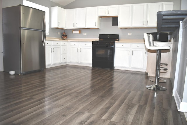 1080 Redondo Dr, Romeoville, IL 60446 - kitchen featuring freestanding refrigerator, black range with gas stovetop, dark wood-style flooring, white cabinetry, and light countertops