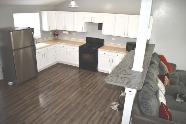 1080 Redondo Dr, Romeoville, IL 60446 - kitchen featuring freestanding refrigerator, black range oven, white cabinetry, dark wood-type flooring, and light countertops
