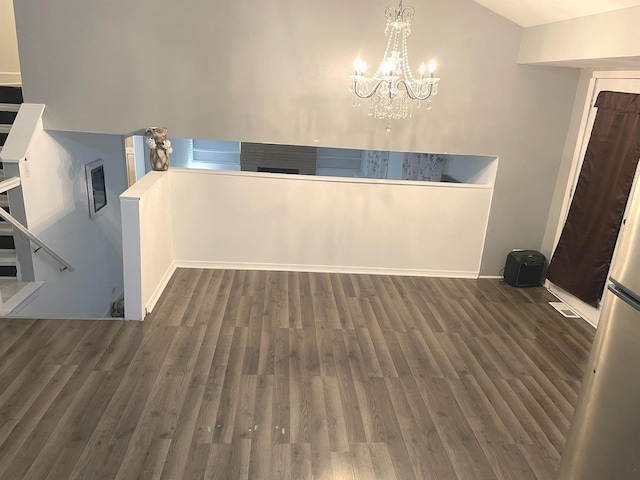 1080 Redondo Dr, Romeoville, IL 60446 - unfurnished dining area featuring a chandelier, wood finished floors, and vaulted ceiling