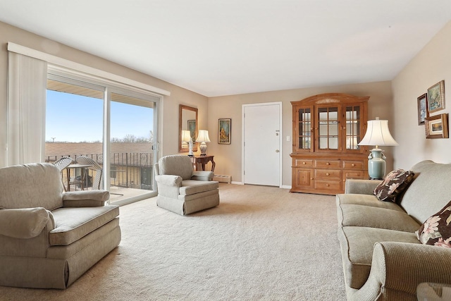 carpeted living area featuring a baseboard heating unit and baseboards