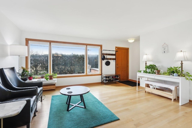 living room featuring light wood-style floors and baseboards