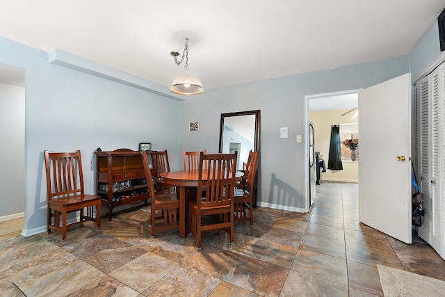 dining room with baseboards