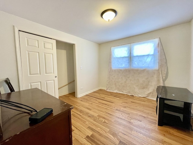 office featuring light wood finished floors and baseboards