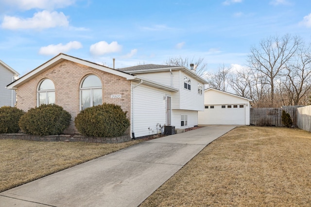 view of property exterior featuring fence, a yard, cooling unit, an outdoor structure, and a garage