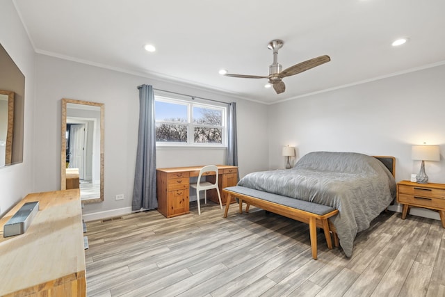 bedroom featuring recessed lighting, crown molding, and light wood-style floors