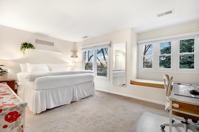 bedroom featuring carpet floors, baseboards, and visible vents