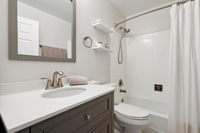 full bath with shower / tub combo, vanity, and toilet