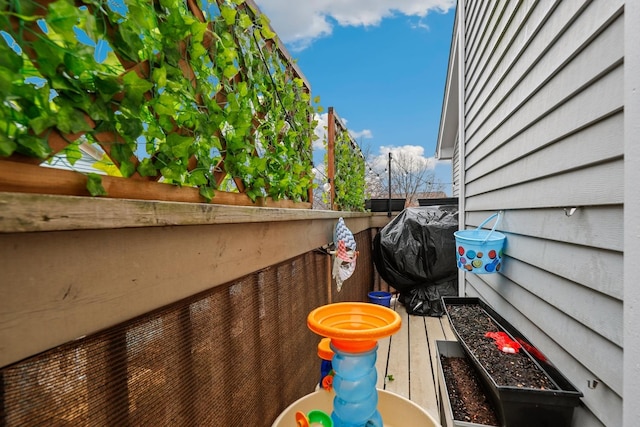 wooden terrace featuring area for grilling