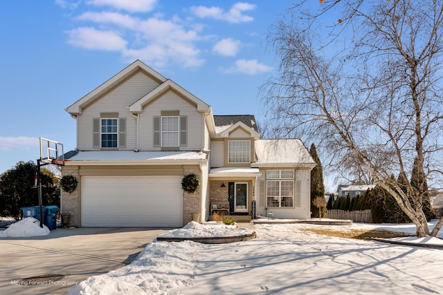 traditional-style house featuring concrete driveway, brick siding, and an attached garage