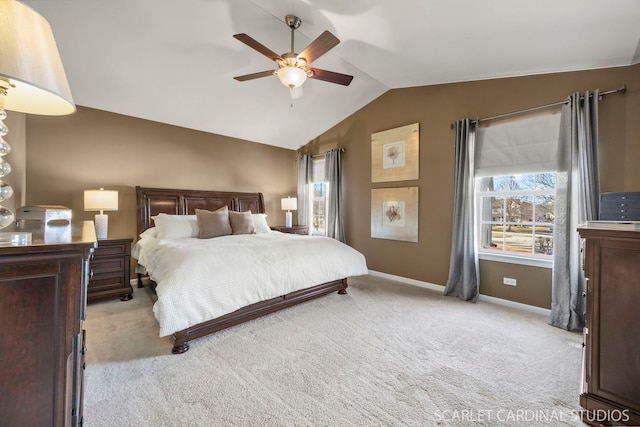 bedroom with vaulted ceiling, a ceiling fan, baseboards, and carpet floors