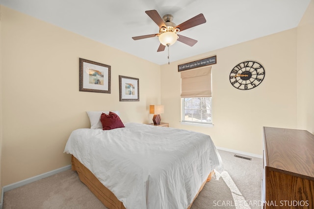 bedroom with visible vents, baseboards, a ceiling fan, and carpet flooring