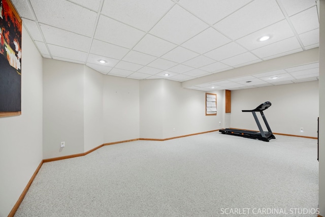 exercise area featuring recessed lighting, a paneled ceiling, baseboards, and carpet