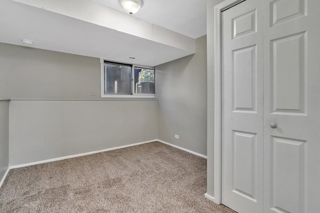 interior space featuring carpet floors and baseboards