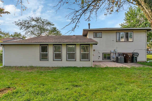 back of property featuring a patio and a yard