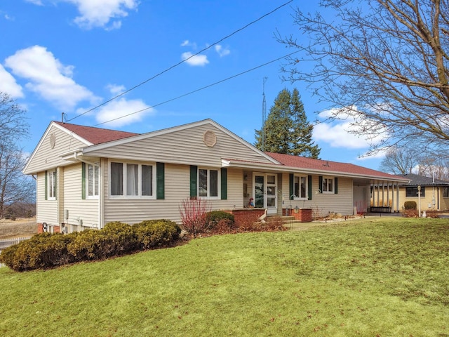 rear view of property featuring a yard