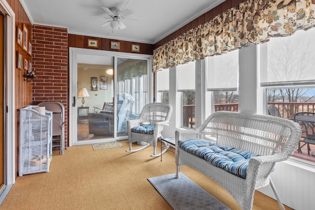 sunroom with a ceiling fan