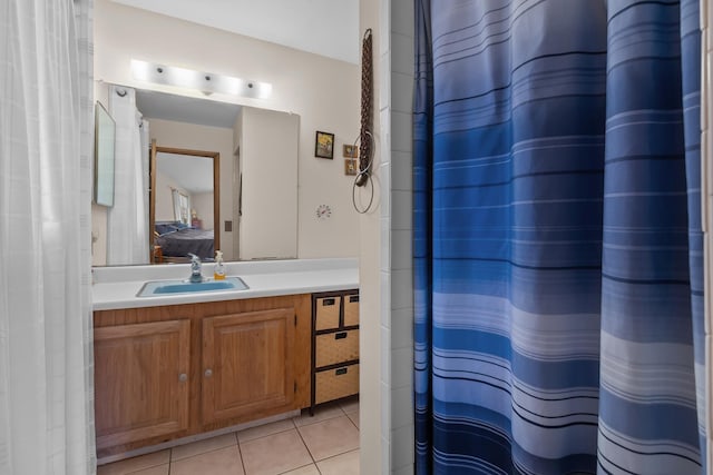 full bathroom featuring curtained shower, vanity, ensuite bathroom, and tile patterned floors