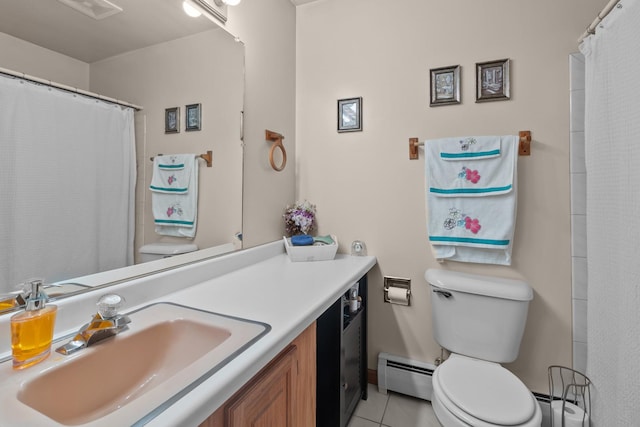 bathroom featuring toilet, vanity, baseboard heating, and tile patterned floors