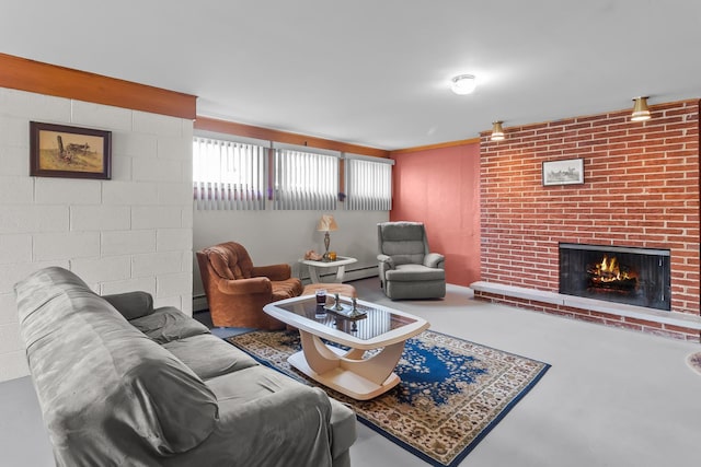 living area featuring a fireplace, a baseboard heating unit, and concrete flooring