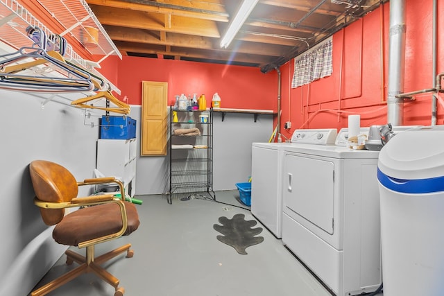 clothes washing area with washer and dryer