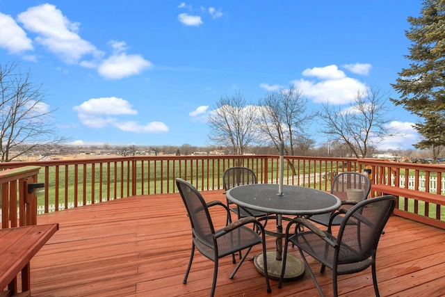 wooden deck with outdoor dining area