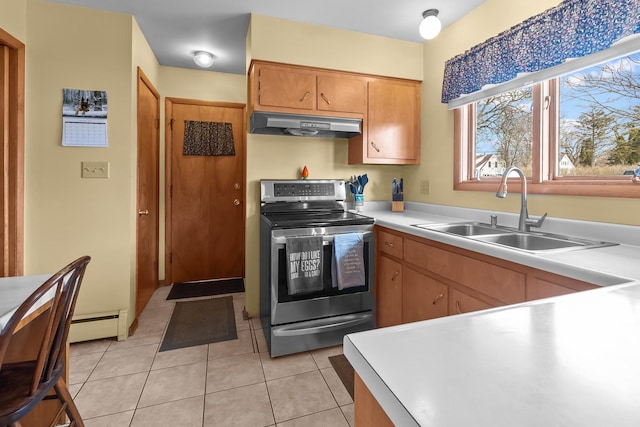 kitchen with light tile patterned flooring, under cabinet range hood, a sink, light countertops, and stainless steel electric range oven