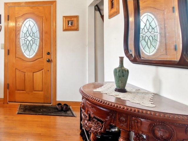 foyer featuring wood finished floors