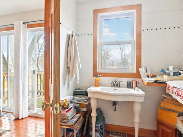 bathroom featuring visible vents and wood finished floors