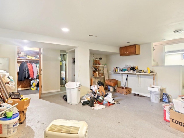 interior space featuring water heater and baseboards