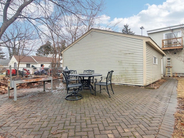 view of patio / terrace with outdoor dining area and fence