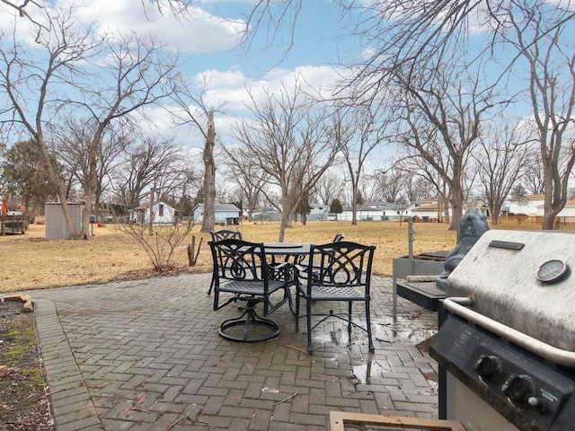 view of patio / terrace with outdoor dining area and a grill