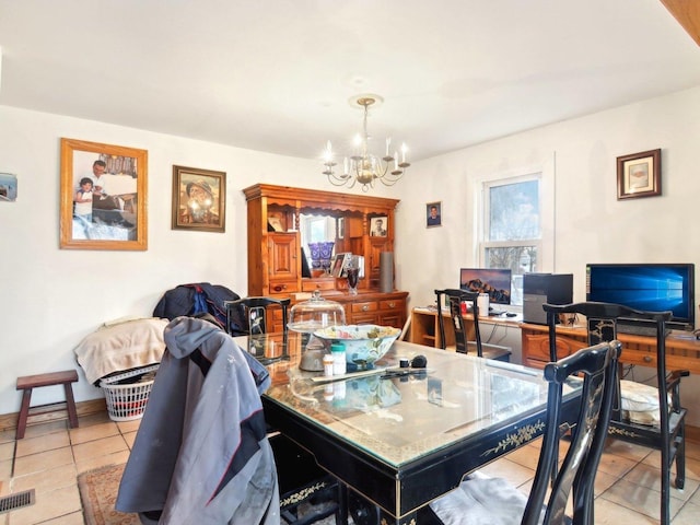 dining room featuring light tile patterned floors, baseboards, visible vents, and a notable chandelier