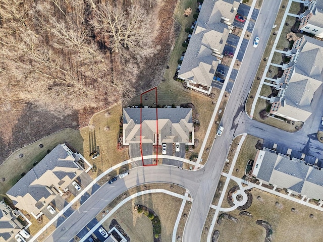 birds eye view of property with a residential view